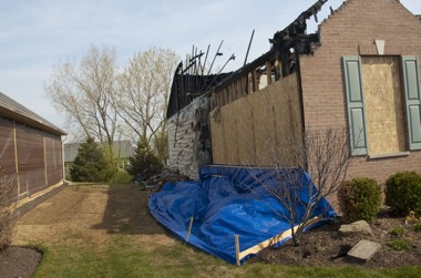 At approximately 12:23 a.m. on Saturday, April 2, 12542 Muir Drive sus- tained considerable, if not total, damage in a structure fire. The exact cause is unknown, but a leak in the Nicor gas meter is suspected. (Photo by Chris LaPelusa/Sun Day)