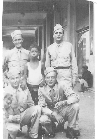 Soucheck (bottom left) holds a monkey in Casablanca, Africa in ’43 or ’44.