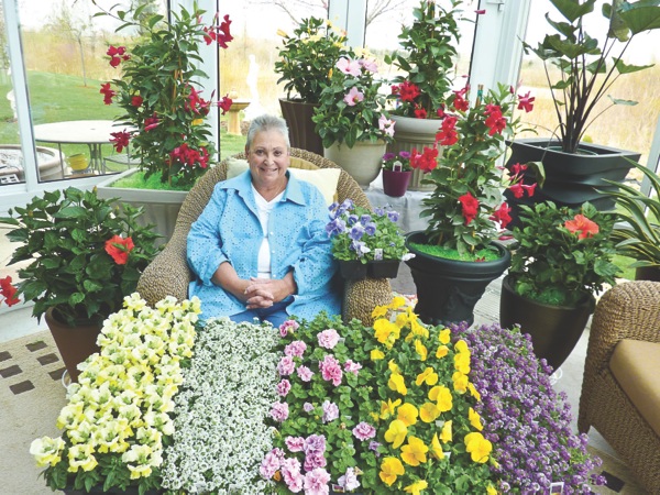 From plants and flowers to other gardening related items, Sun City resident Diane Bell sells it all as an independent wholesale representative and loves what she does. (Photo provided)