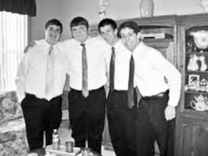 Barbershop quartet "Individuality" warming up at the Cesarone residence. From left, David Bacon, Josh Dunn, Eric Iannelli, and Christian O'Kelley. (Photo provided)