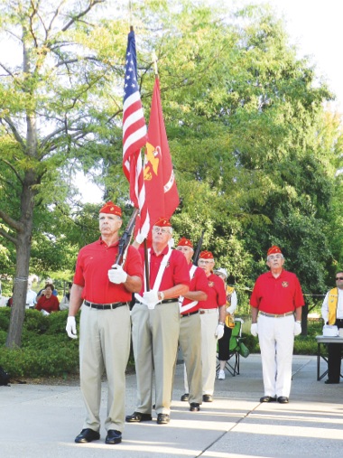 Sun City Huntley Marines present Colors before leading audiences in Pledge of Allegiance.