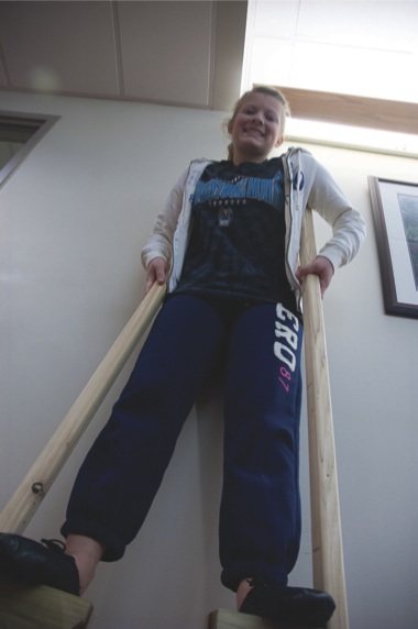 Fourteen-year-old Sun City granddaughter Julia Slomski practices walking on stilts for her role as Agnes Smith in The Theatre Company of Sun City’s November production Meet Me in St. Louis. (Photo by Chris LaPelusa/Sun Day)