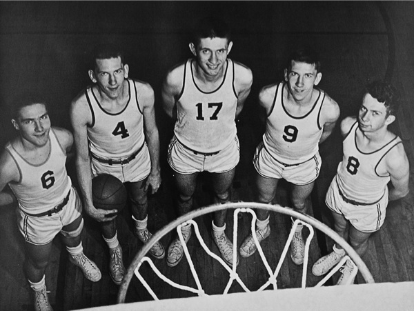 Members of the 1951-1952 Hebron-Alden High School championship basketball team pose for a photo. Ken Spooner, far left, is wearing jersey #6. (Photo provided)