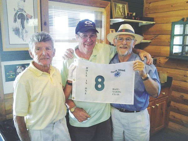 From left to right, Chuck Loveisky, Wyman Carey, Tom Andersen celebrate Carey's hole in one at Craig Woods golf course on May 29. (Photo provided)