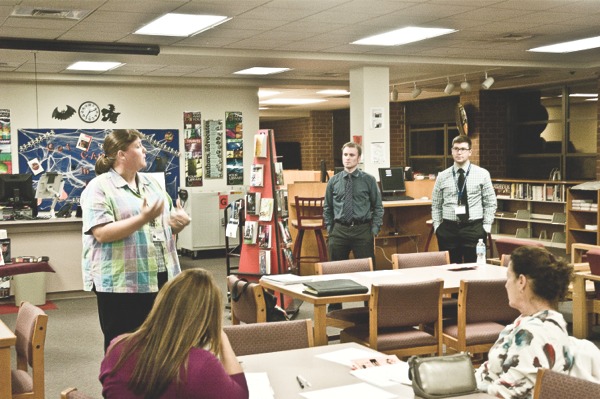 Huntley High School math teacher and athletic trainer Re- nae St. Clair speaks before medical academy volunteers at the school library on Oct. 16. The medical academy was built from St. Clair’s original idea of an athletic training course. (Photo by Mason Souza/Sun Day)