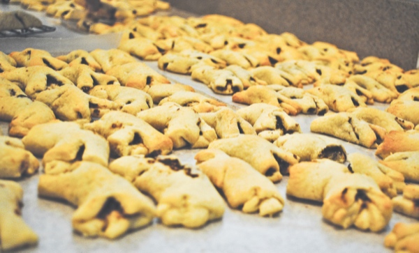 The cucidati cool on a tray before being glazed and sprinkled. (Photo by Rebecca Vasquez/Sun Day)