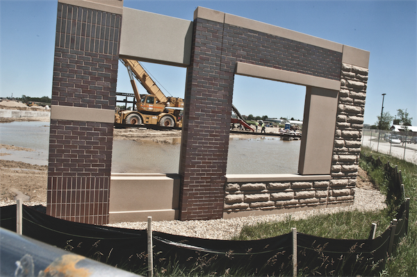 A test structure of the hospitals facade that the builders will monitor for wear and durability throughout construction of the primary hospital. (Photo by Chris LaPelusa/Sun Day)