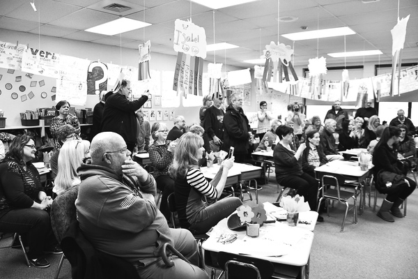 A round of grandparents enjoy the program at Grandparents Day.