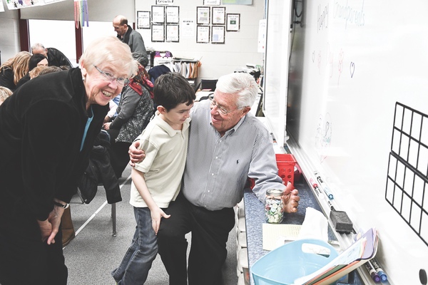 Janet and John Thunhom with student Khristos Skoufis guess how many items are in a jar at Chesak Elementary’s Grandparents’ Day. They guessed sixty-six! (Photos by Christine Such/Sun Day)