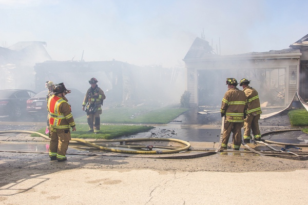 Area firefighters worked for five hours to control a house fire that started on on the 14000 block of Saffron Trail. High winds caused the fire to damage multiple houses. (Photos by Tony Pratt/Sun Day)