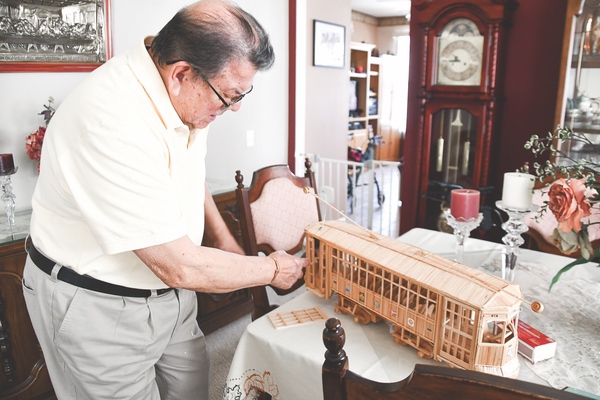 Sun City resident Cesar Vega cre- ates intricate structures with toothpicks. (Photos by Christine Such/Sun Day)