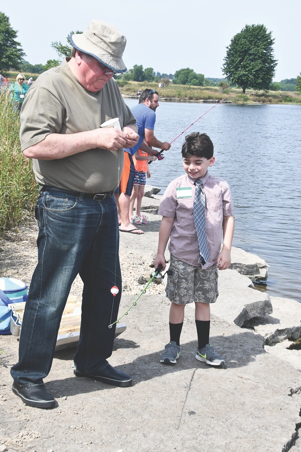 Payton Klopfenstein (Mr. Tie), dressed formally for a fishing date with Grandpa Kraig. (Photo by Christine Such/Sun Day)