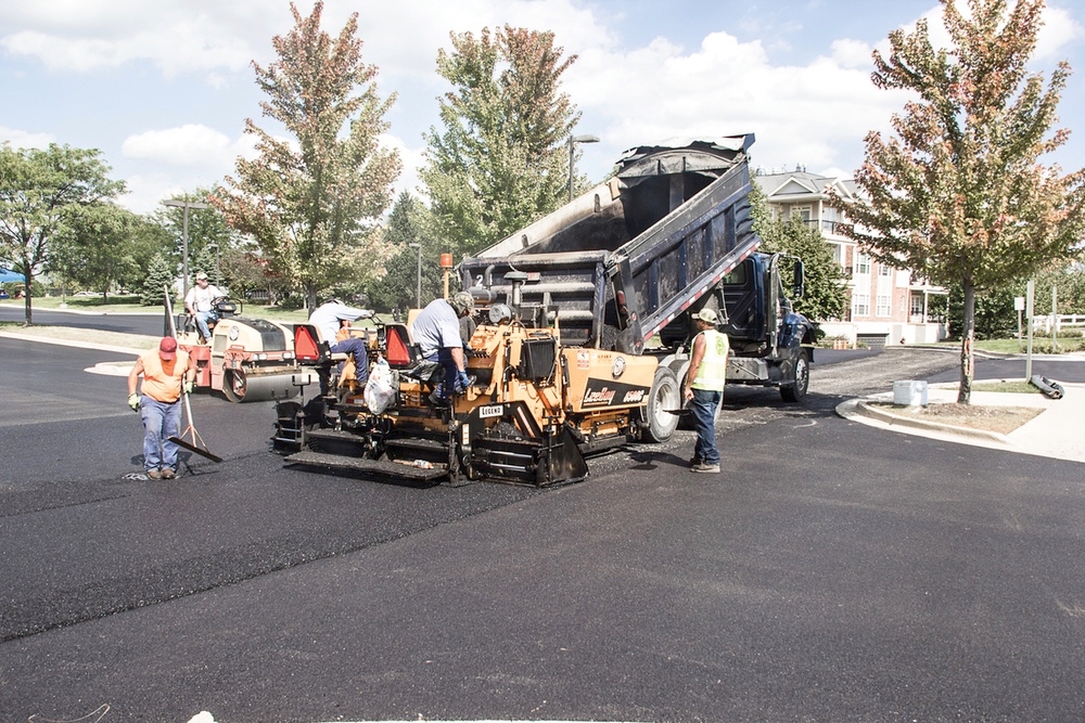 Crews resurfacting Meadow View Lodge parking lot. (Photo by Tony Pratt/Sun Day)