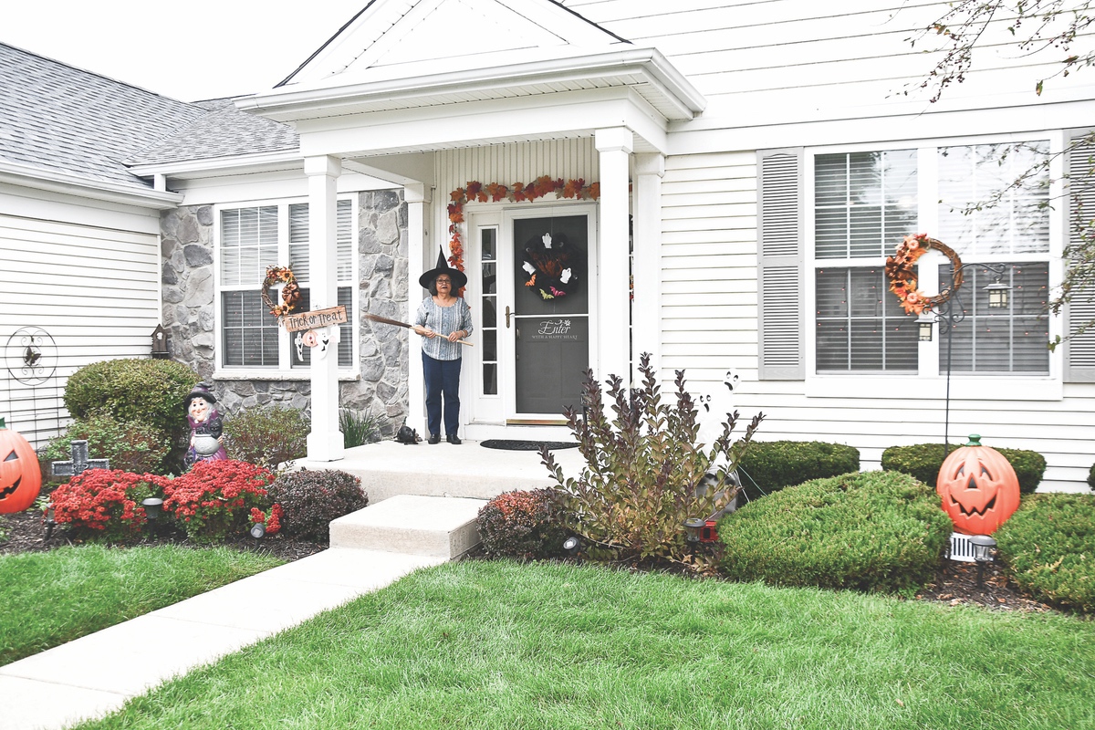 Anything more common or standard than a “witch” (Addie Metoyer) welcoming you to their home on Halloween? (Photos by Christine Such/Sun Day)