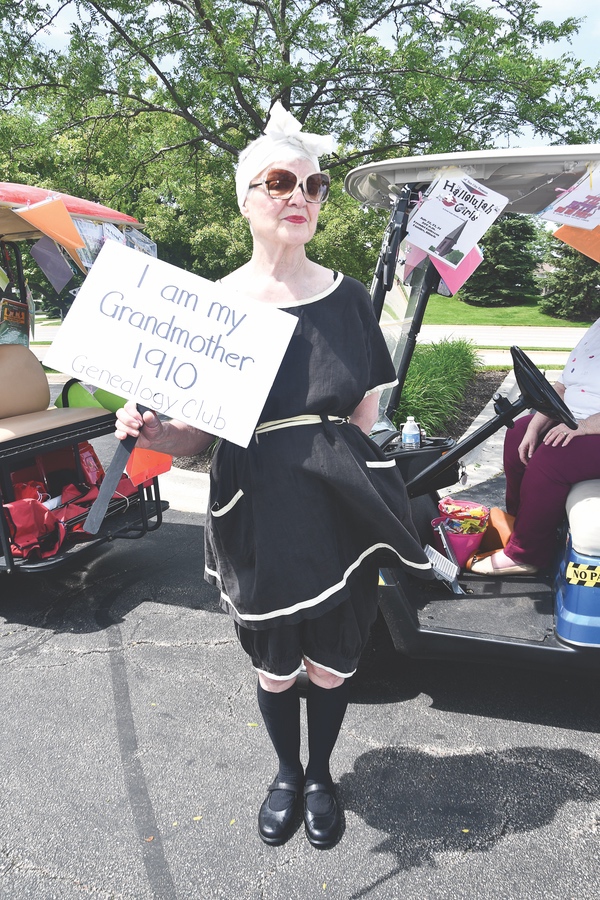 For the golf cart parade, Helen Wiederkehr, Treasurer of the Geneology Club Dresses in her grandmother’s handmade swimsuit.