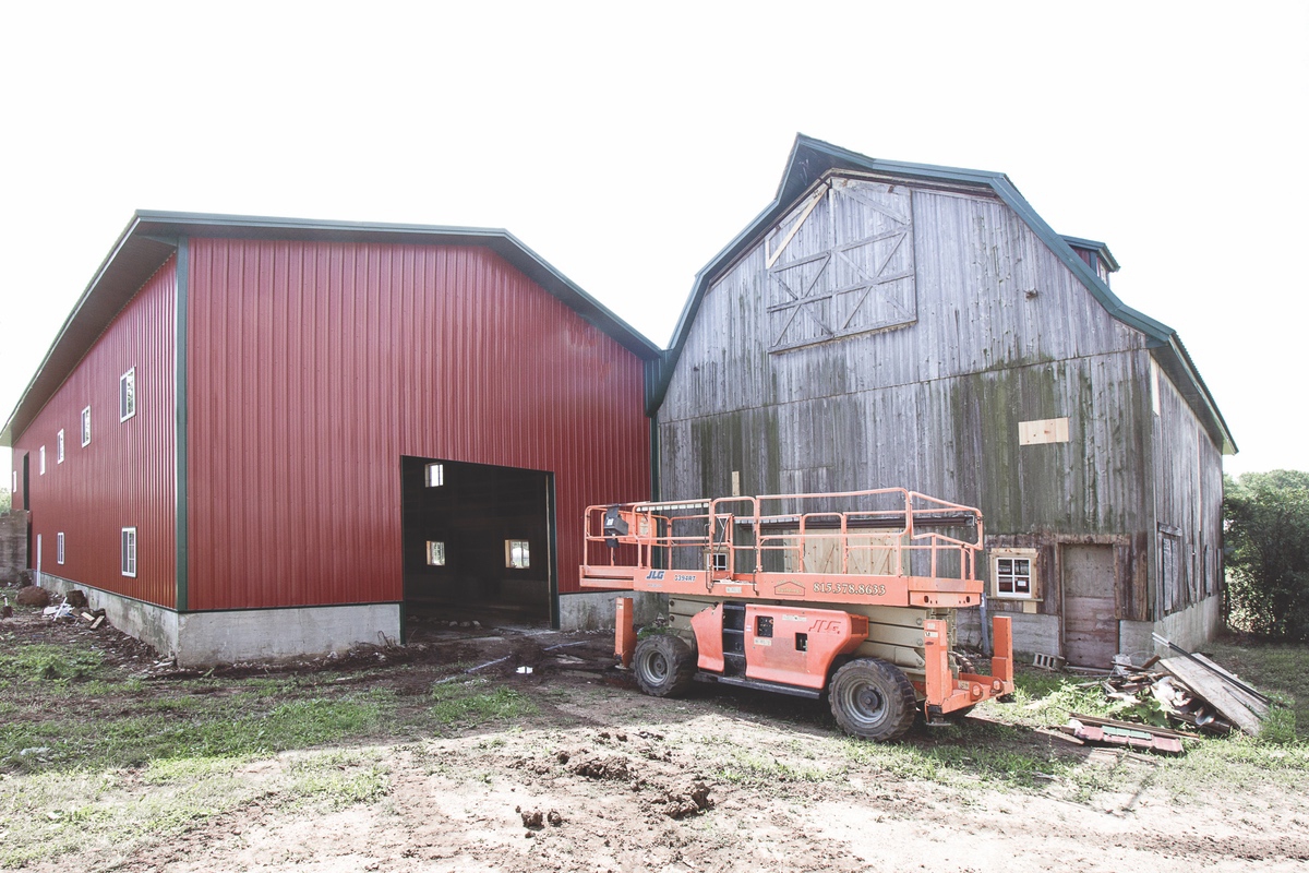 Twenty years ago, Huntley farmer and concrete contractor Tom Manning purchased six acres of farm land on the south side of Kreutzer. Today he’s renovated the barn and land and is using it to produce hemp. (Photo by Tony Pratt/Sun Day)