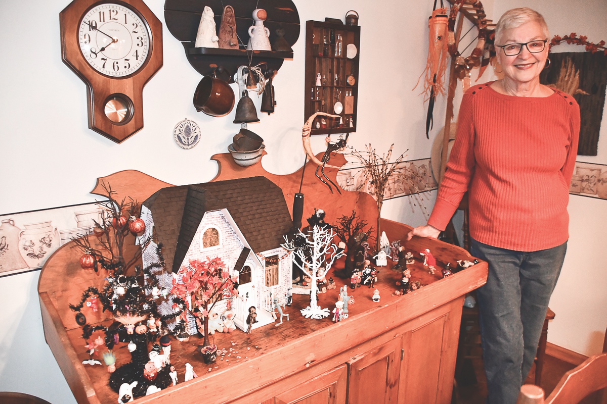 Helen Wiederkehr stands with her Trick or Treating scene. (Photos by Christine Such/Sun Day)