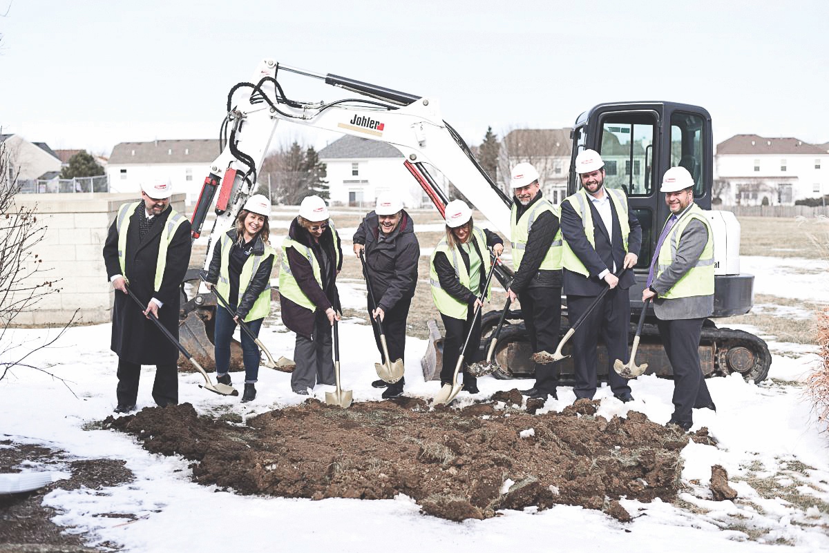 The Huntley Area Public Library Board of Trustees and staff break ground as construction commences. (Photo provided)