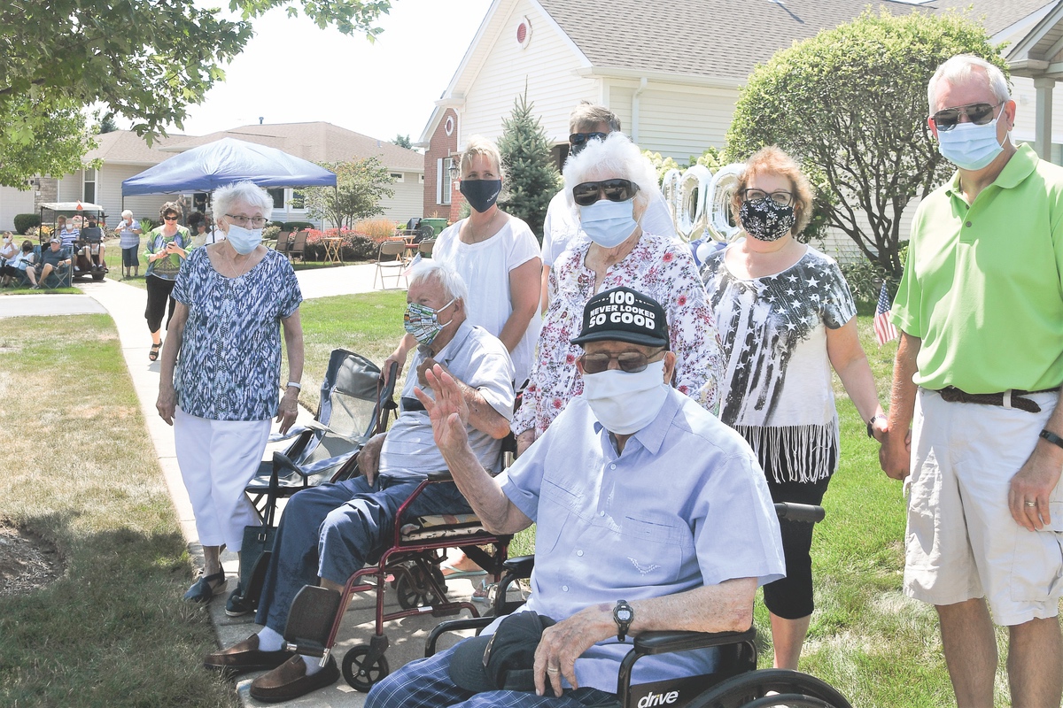 100 looks good on John Kligis, a Navy veteran, who gathered with family and friends to celebrate a drive-by birthday. (Photos by Christine Such/Sun Day)