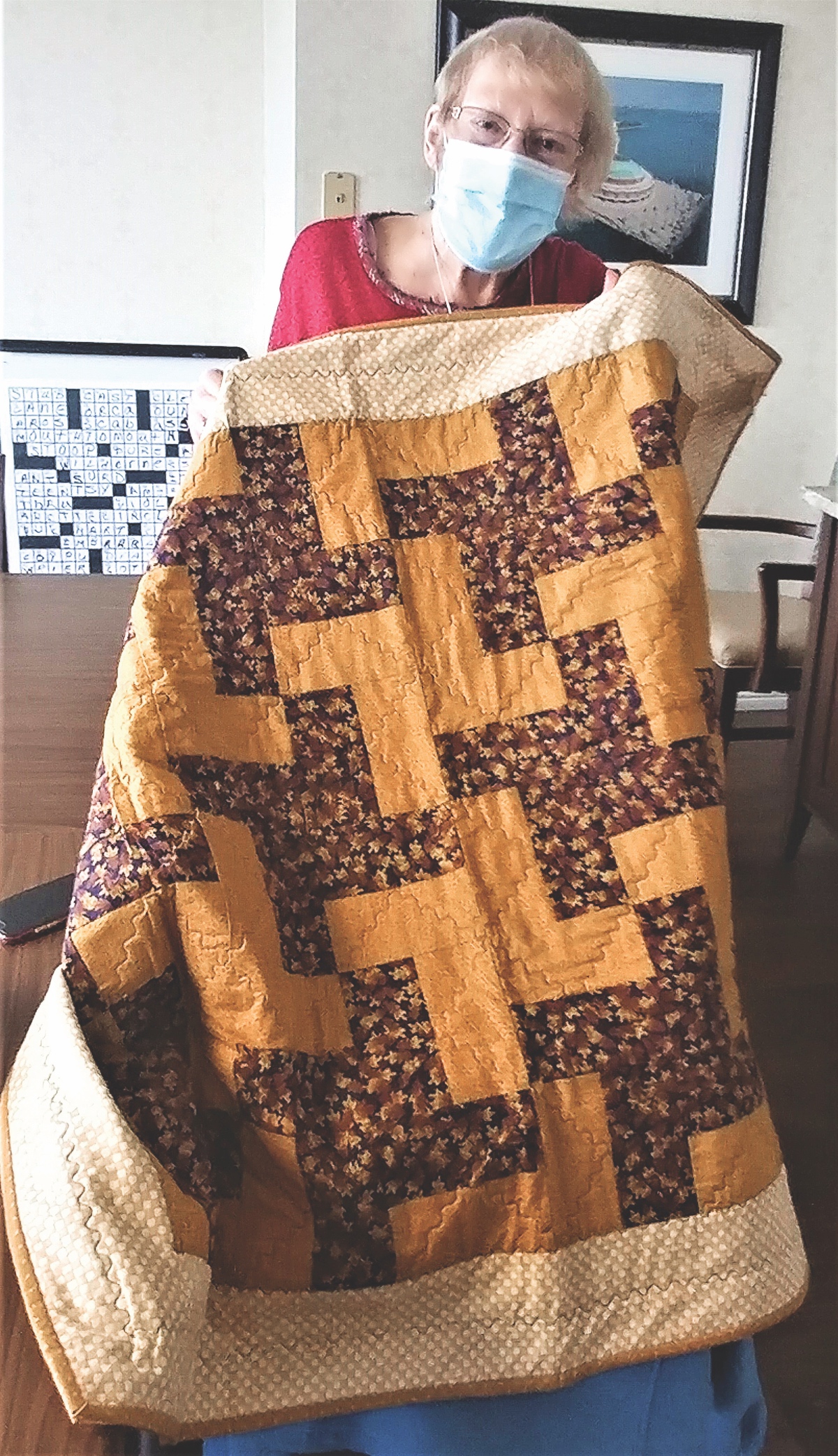 SC resident Judy Wilmer receives comfort quilt that makes her feel “at home.” (Photo by Christine Such/Sun Day)