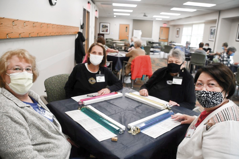 Amidst loosening of resriction, like many others, the Mah Jongg Club is back to meeting. L to R: Lynne Shkolnik - President, Marsha Natkins - Treasurer, Mary Belcher - Vice President, Stella Marschak - Secretary. (Photo by Christine Such/Sun Day)