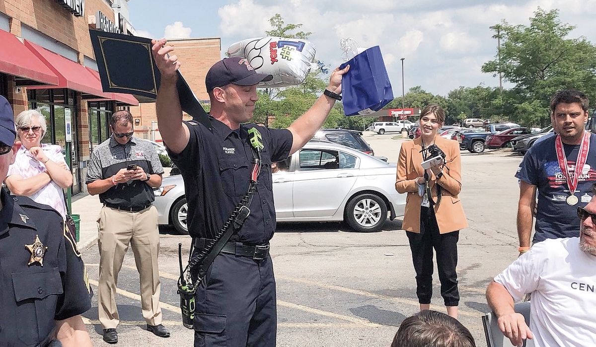 Huntley Firefighter Nate Ivetic, celebrates his win of the donut eating contest. (Photo provided)