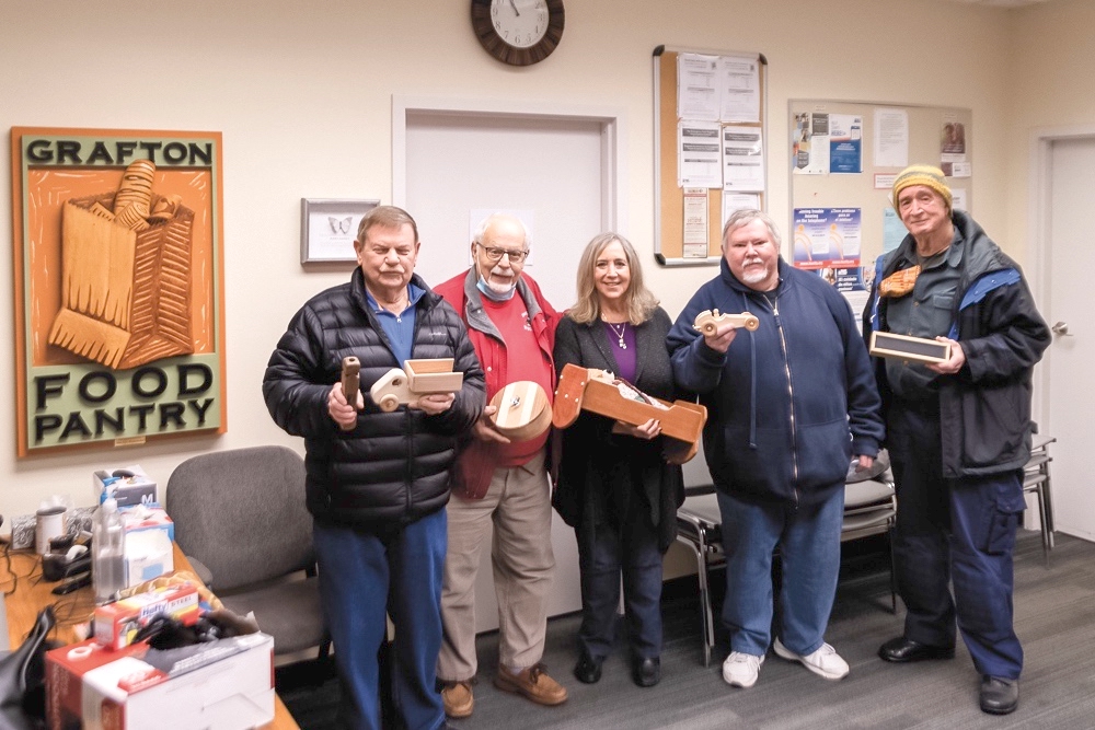 Harriet Ford accepts Woodchucks toy donation from members (L to R) B. Freimuth, A. La Pelusa, M. Mulroe, R. Escallier. (Photos by Brandon McBryde/My Huntley News)