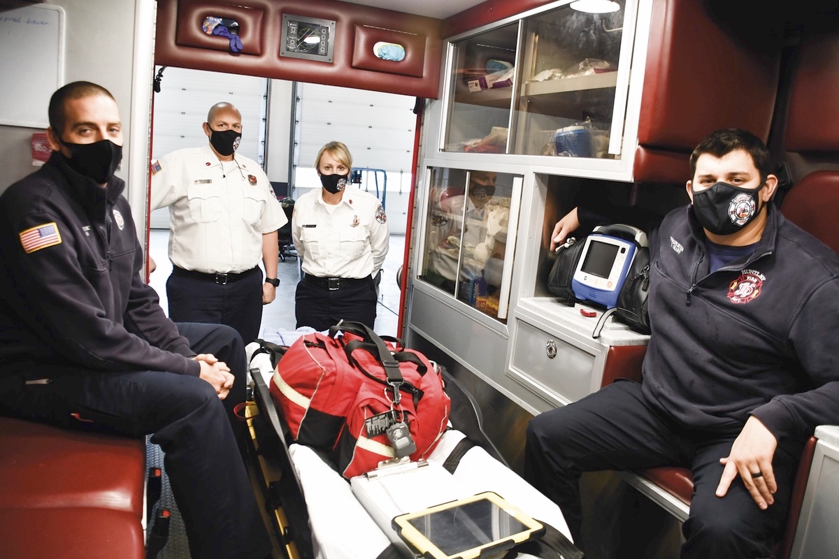 Members of the Huntley Fire Department are trained to provide care at the advanced life-support (paramedic) level. Shown here are (L to R) Firefighter Paramedic Jon King, Director of EMS Lt. Brian Harders, Director of Mobile Integrated Health Lt. Kelly Gitzke, and Firefighter Paramedic Nick Sharp. (Photo by Christine Such/My Sun Day News)