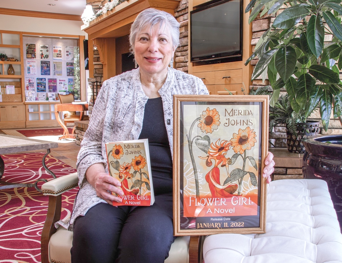 Out of approximately 4,000 entrants, local author Merida Johns wins major award for her book cover design. (Photo by Tony Pratt/My Sun Day News)