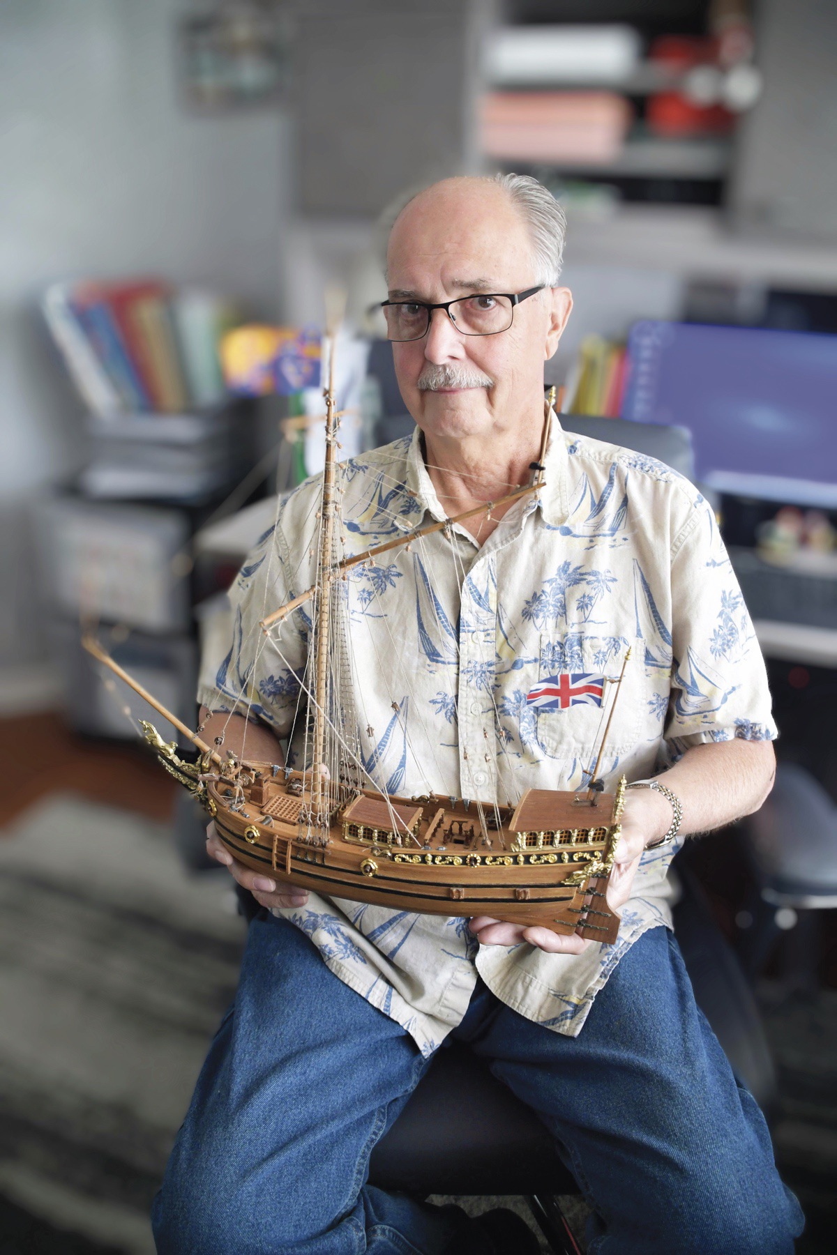 Jim Eggers shows off his completed model of Yacht Mary, which he’s worked on for forty years. (Photo by Christine Such/My Sun Day News)