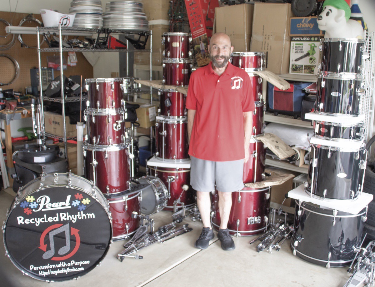 Sun City resident Alex Macaluso prepares donated drumsets intended for donation to children with special needs. (Photo by Tony Pratt/My Sun Day News)