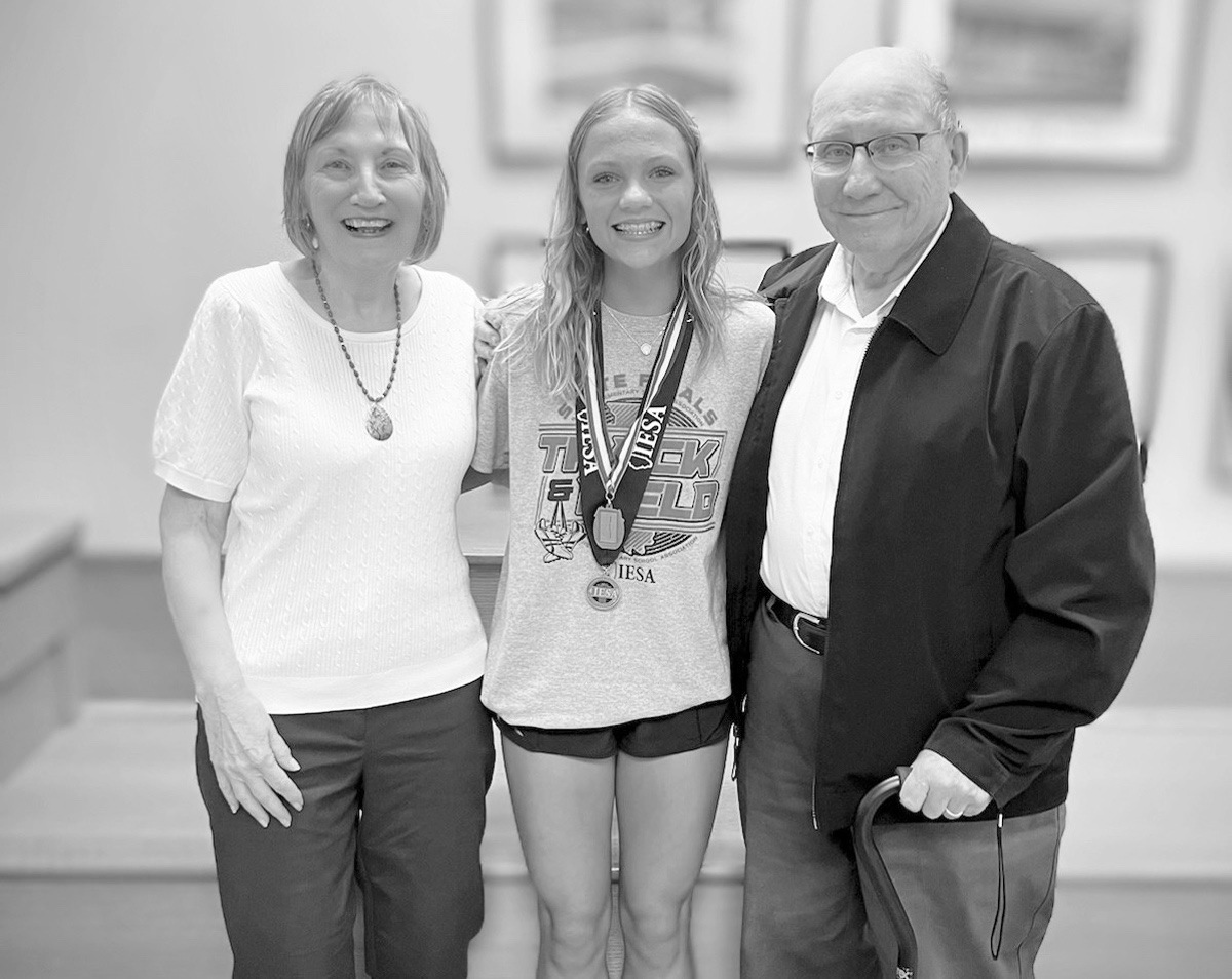 Karen and Jay Semancik with granddaughter Myla Wade, who finished second place in the IESA eighth-grade 400-meter run. (Photo by Christine Such/My Sun Day News)