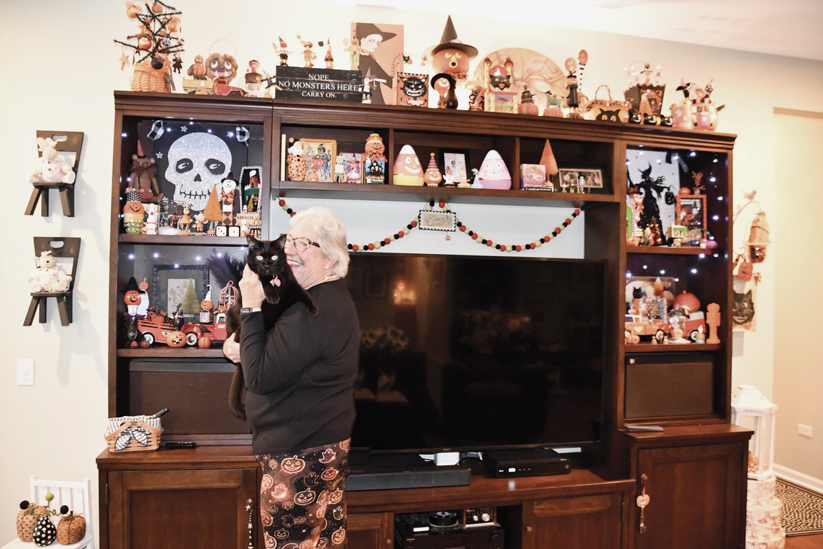 Sun City resident Lucy Tracy is ready for a Haunting Halloween with her cat Tanky. (Photo by Christine Such/My Sun Day News)