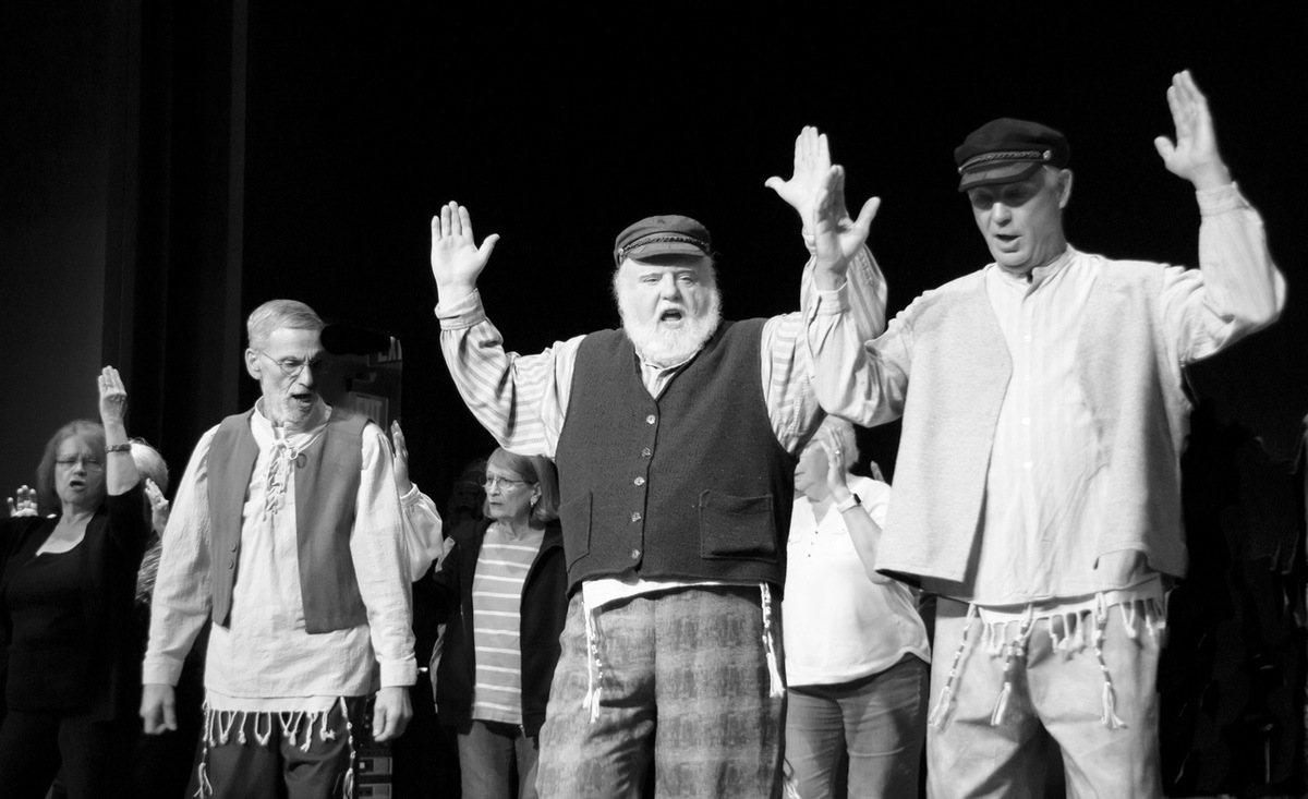 L to R: Burt Natkins, Frank Gaughan, and John Froberg lead cast during a musical scene. (Photo by Tony Pratt/My Sun Day News)