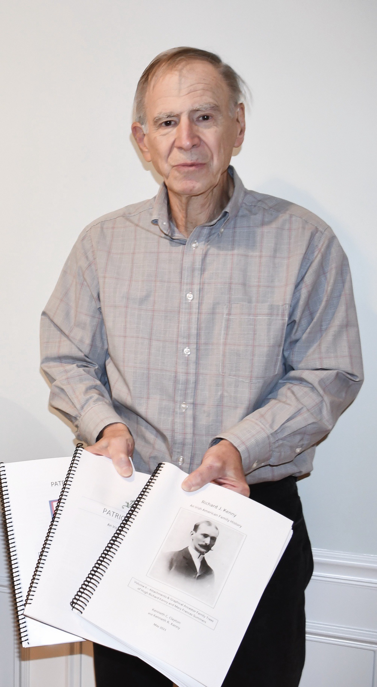 Ken Kenny holds the books written by him and his cousin on their ancestors aboard the Mayflower. (Photo by Christine Such/My Sun Day News)