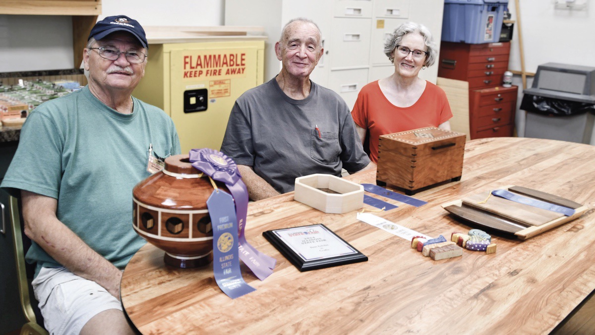 Illinois State Fair ribbon winners Ed Cuttle, Rich Escallier, and Judy Escallier with their pieces. (Photo by Christine Such/My Sun Day News)