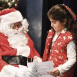 Sun City granddaughter Victoria Jimenez shares her Christmas list with Santa at the recent Grandma, Grandpa & Me breakfast with Santa. (Photo by Christine Such/My Sun Day News)