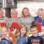 Three generations of the Dungey family baking Christmas cookies, a tradition that spans 42 years. (Photo by Christine Such/My Sun Day News)