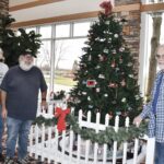 Model Railroad Club Members (L to R) Dale Svoboda, Mike Nicholson, and Joe Vavra add to the Holiday Display at the Prairie View Lodge. (Photo by Christine Such/My Sun Day News)