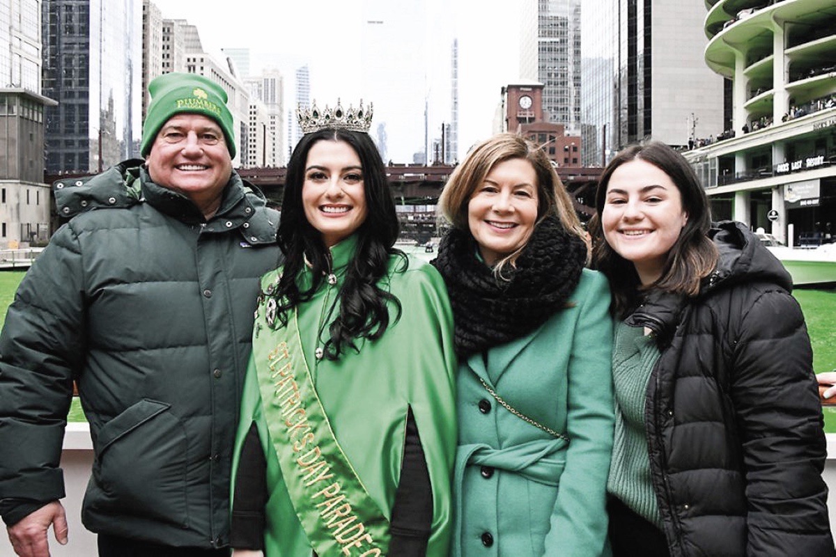 Joe and Kim (second from right) Doherty celebrate the love story that led to their family and family business. They’re featured here at a St. Patrick’s Day celebration in Chicago with daughters Casey (wearing crown) and Delaney (right). (Photo provided)